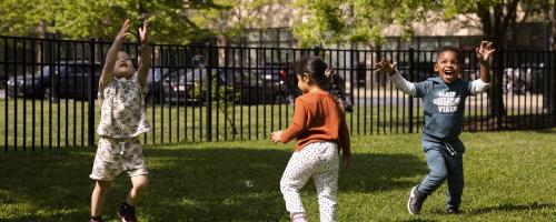 Children blowing bubbles