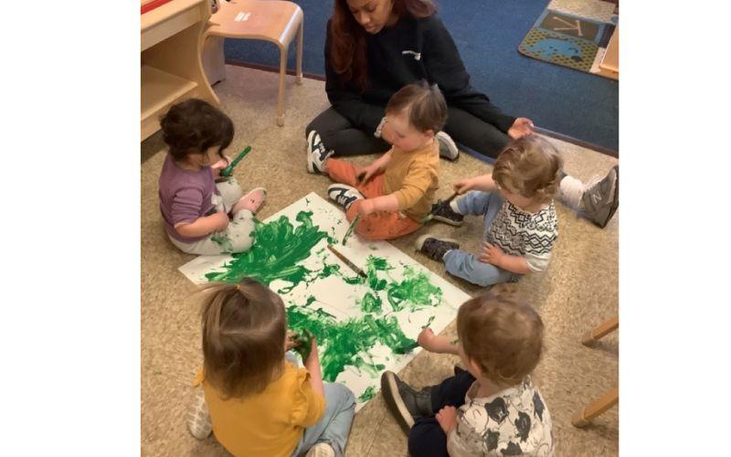 Toddlers fingerpainting at preschool