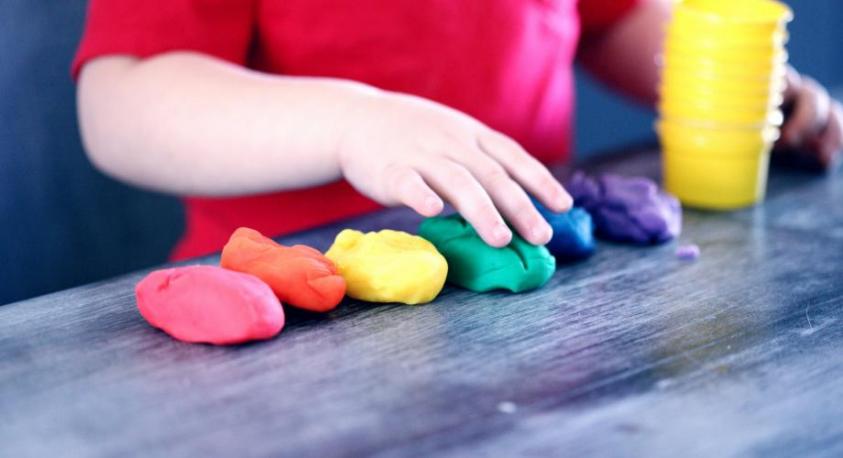 Child playing with playdoh