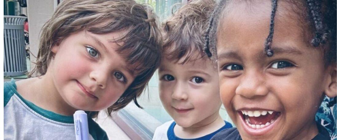 Closeup of three preschoolers' faces