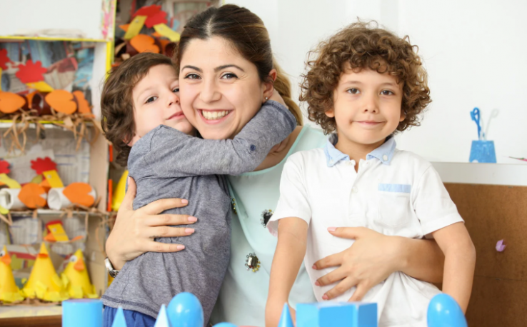 Mom picking up preschoolers